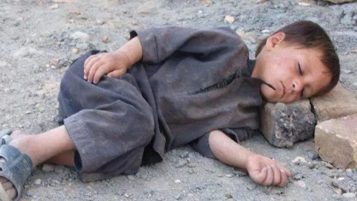 A-child-sleeps-using-stones-as-pillow.jpg | Eid Eid