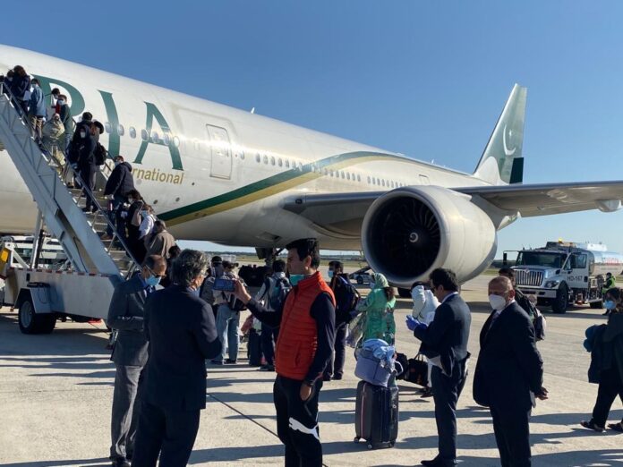 Passengers-boarding-a-PIA-plane-specially-arranged-to-ferry-stranded-Pakistanis-back-home.jpg