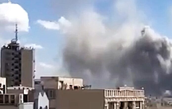 A smoke-filled scene after a strike on Tehran March 1 2026