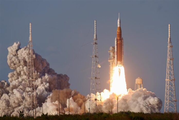 NASA's Space Launch System rocket and the Orion spacecraft lift off from Kennedy space center