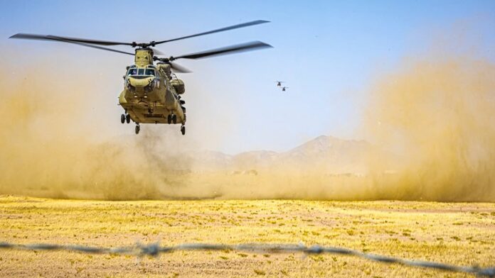 A U.S. Army CH-47 Chinook helicopter prepares to land in the Middle East CENTCOM image